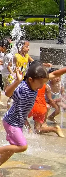 kids playing in fountain