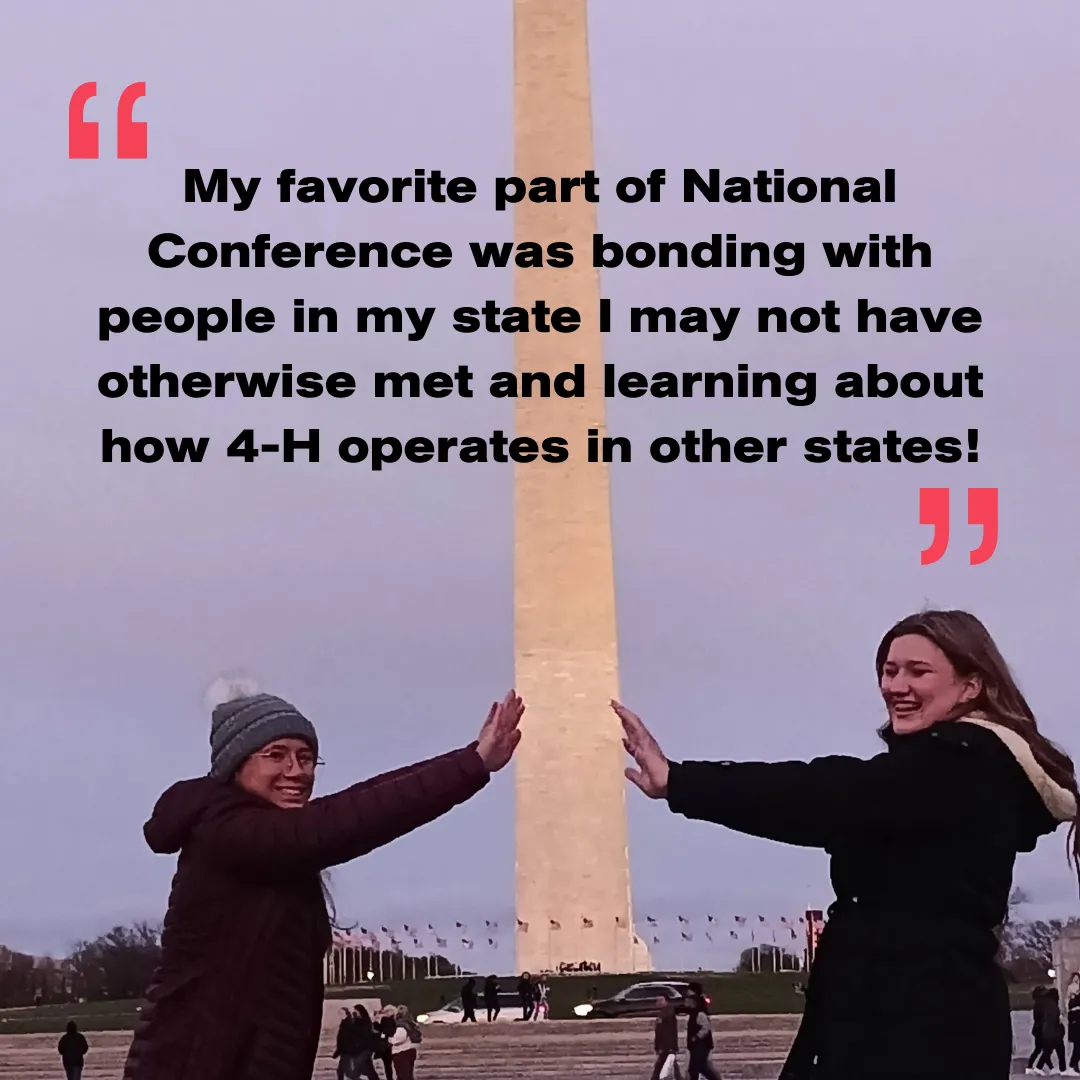 2 youth posting with the Washington Monument