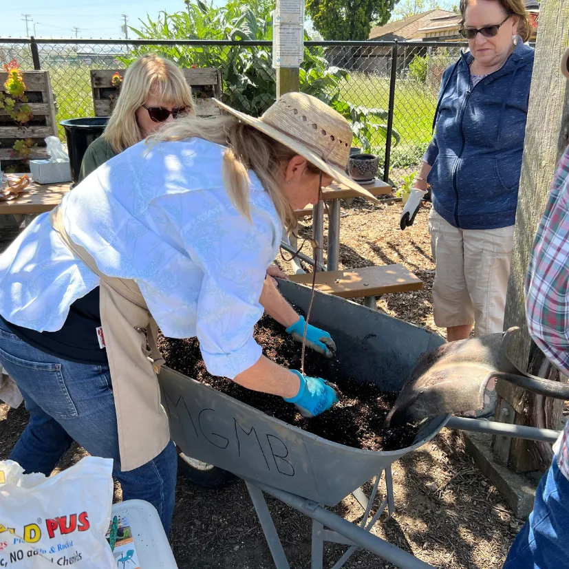Master Gardener demonstrating soil composition