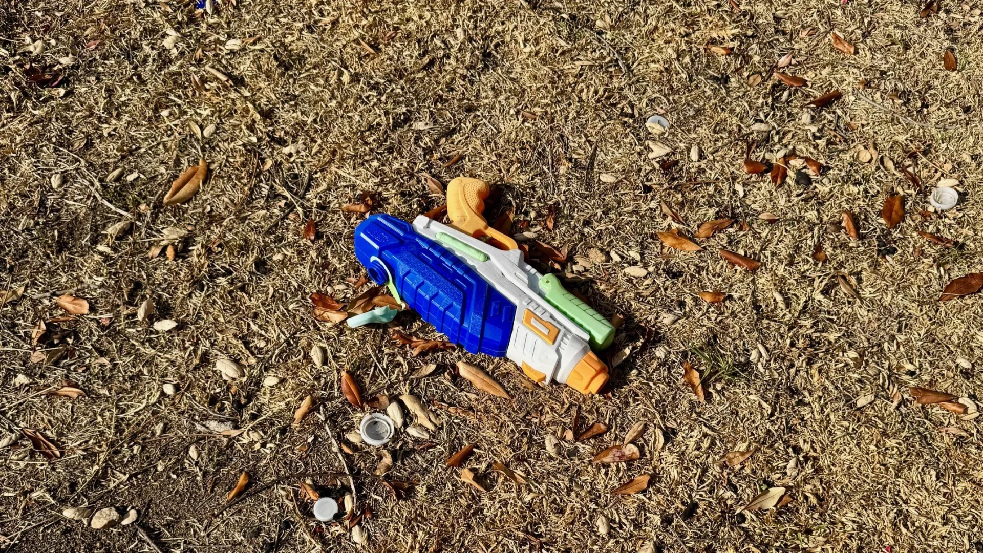 Squirt gun on the ground