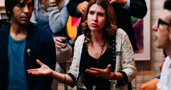 Women speaking in a meeting.