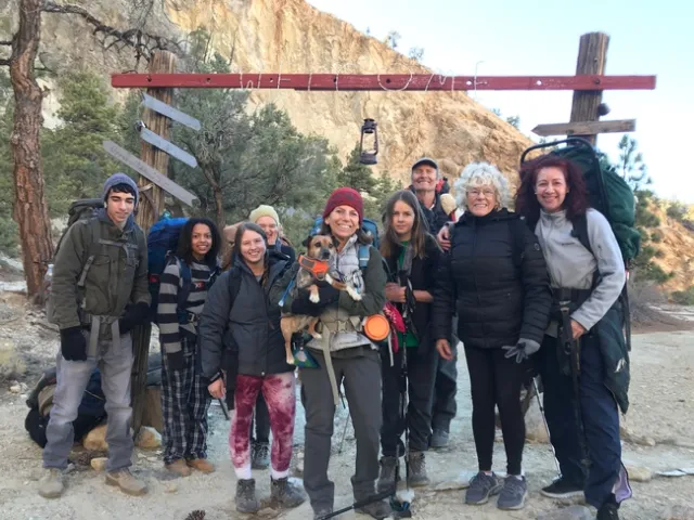 A group people posing in front of a 