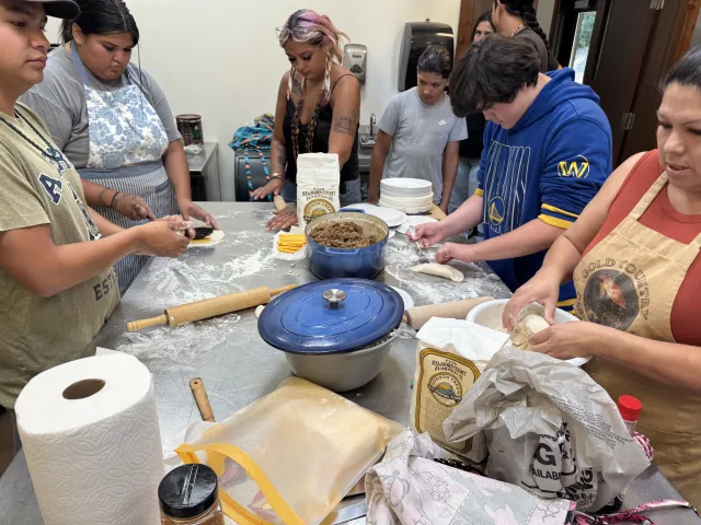 Tribal youth participants engage in a cultural foods demonstration