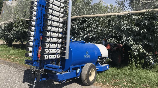 Electrostatic spraying technology deployed in a grove