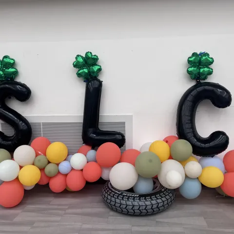 SLC spelled out with balloons