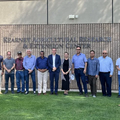Kearney REC researchers and IRTA scientists line up for a photograph in front of the research center