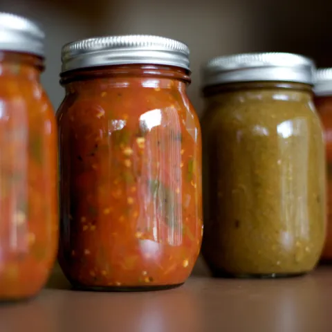 close up of sealed jars of salsa