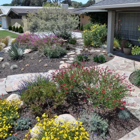 residential house with fire-smart landscaping and pathways