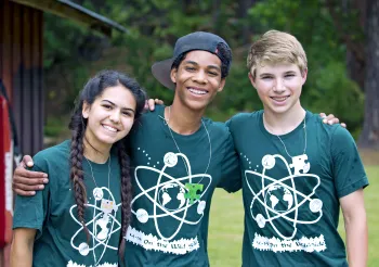 4-H teen leaders teaching science outdoors at Camp Gold Hollow