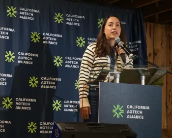 Karen Aceves of ARKEN Strategies speaks at a podium