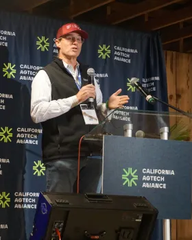 Walt Duflock of Western Growers speaks at a podium