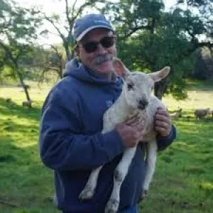 Dan Macon holding a lamb