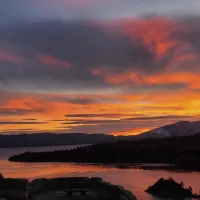 Sunset lake view within a mountain range.